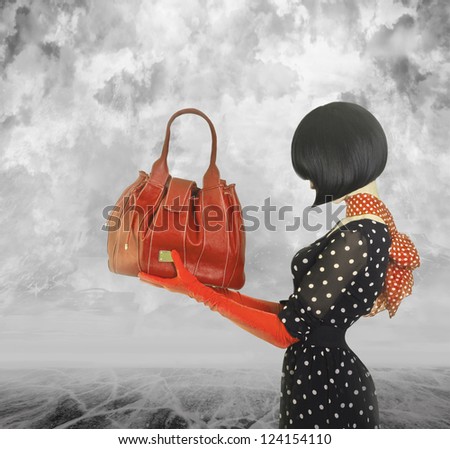 Art photo elegant lady with stylish short hairstyle holding a bag