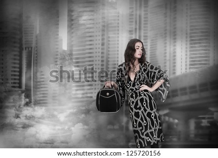 Art photo elegant lady holding a bag