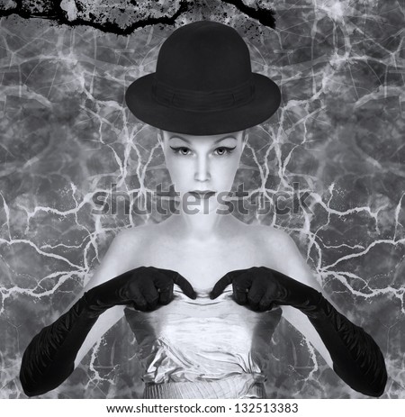 Black and white art photo. Elegant lady with hat and gloves.
