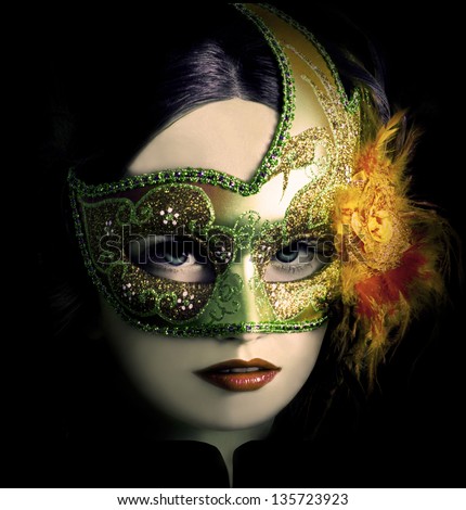 Close up portrait of woman in green mask