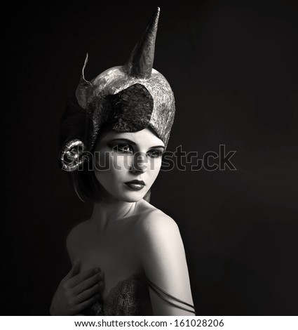 Retro woman portrait with fantasy hat.