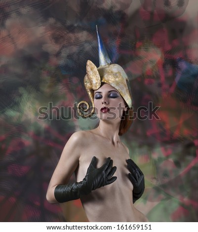 Elegant lady with fantasy hat and gloves.