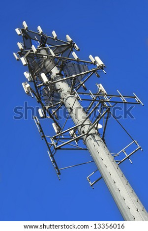 Communication tower over  clear blue sky