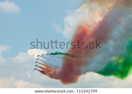 ZHUKOVSKIY, RUSSIA - AUGUST 12: View from the back side of the stands on Italian aerobatic team performance. Celebration of the 100th anniversary of aviation, August 12, 2012 in Zhukovskiy, Russia.
