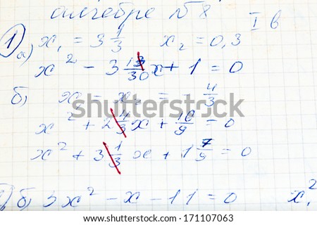 Handwriting test paper on mathematics with teacher`s corrections as background