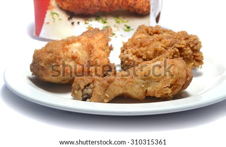 PORT-LOUIS, MAURITIUS - August ?19, 2015: Kentucky Fried Chicken Box with chicken pieces in the forground, KFC is the worlds second largest restaurant chain