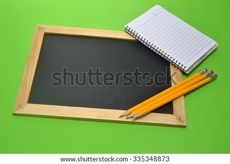 school supplies, pencil, notepad and blank slate