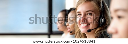 Beautiful caucasian woman wearing microphone headset working in call center with international team as telemarketing customer service agents, panoramic banner