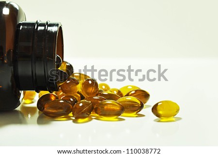 Supplementary food - Omega3 capsules  spilled from the bottle