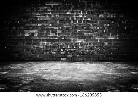 Old dark room with brick wall and concrete floor - as background