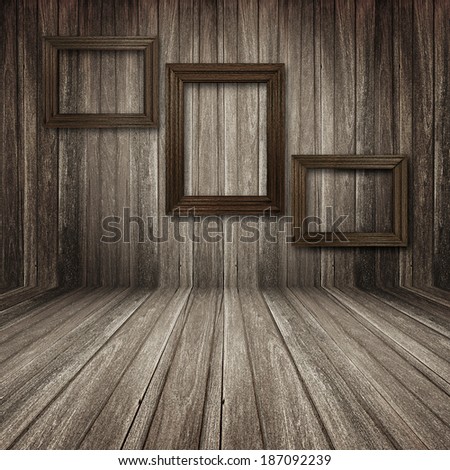 Old wooden picture frames in wooden room