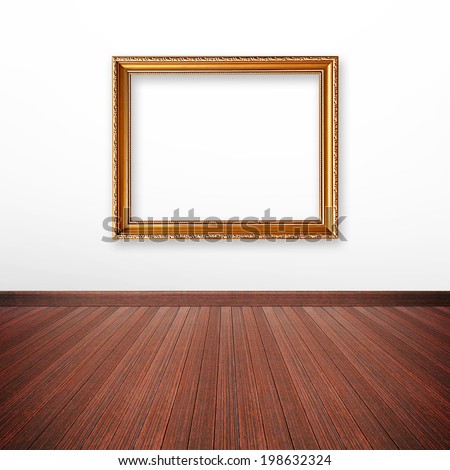 Golden picture frame on the wall inside the room