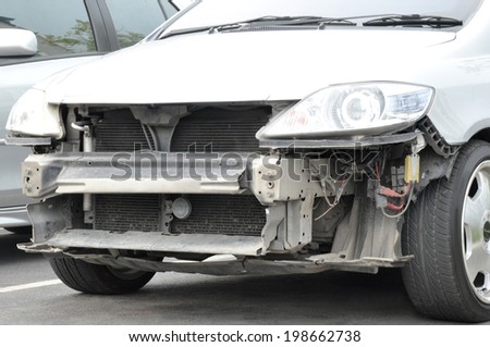 Damaged car with no grille and front bumper