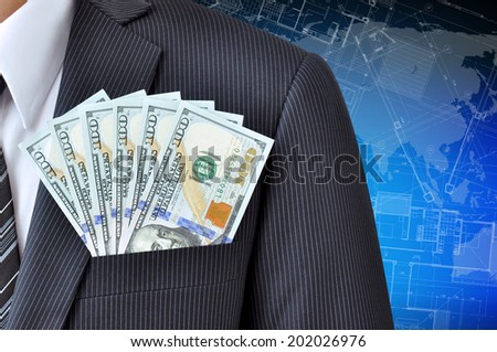 Money - United States dollar (or USD) banknotes in businessman suit pocket