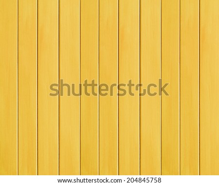 Yellow colored wood plank texture as background