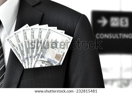 Money - United States dollar (or USD) bills in businessman pocket - financial consulting concept