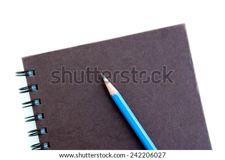 Pencil on notebook (or copybook) - isolated on white background