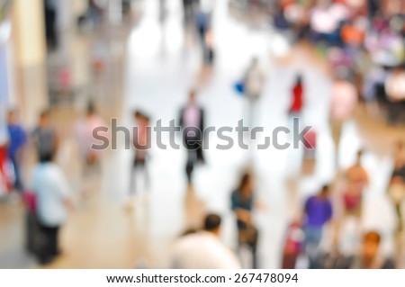 Blurred people at the airport hallway, can be used as background