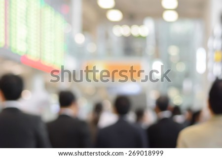 Blurred back view of businessmen inside the building