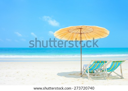 Blue sea and white sand beach with beach chairs and parasol, Samed island, Thailand - holiday and vocation concepts