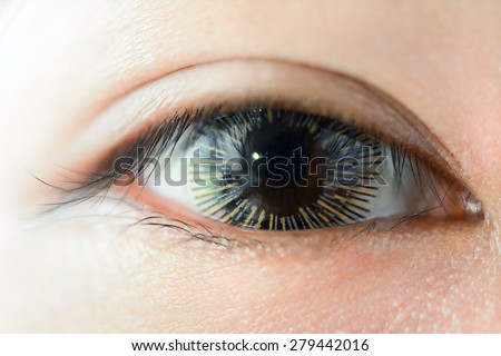 Close up of woman eye wearing fancy contact lens