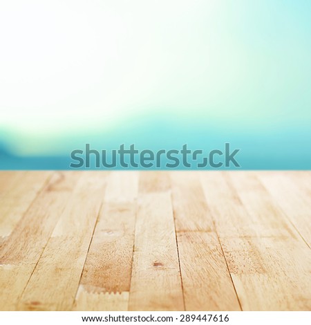 Wood table top on white blue gradient abstract background - can be used for montage or display your products