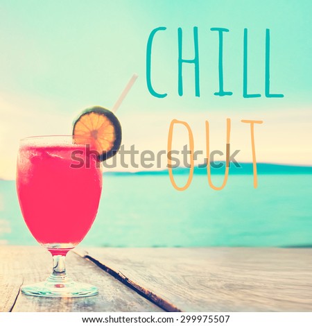 Unfocused cocktail drink on wood table in summer sea and sky background, vintage tone - chill out poster concept