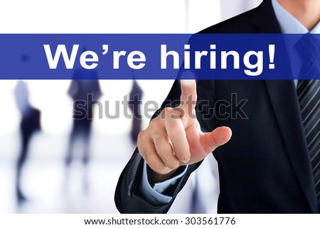 Businessman hand touching We\'re hiring sign on virtual screen