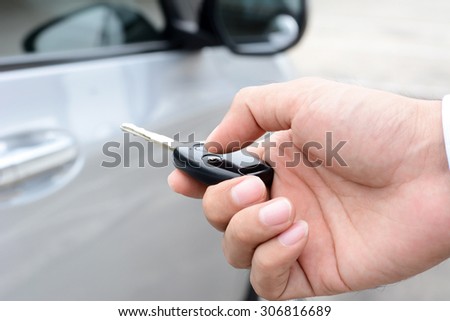 Hand pressing remote control car key