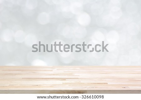 Wood table top on white bokeh abstract background - can be used for montage or display your products