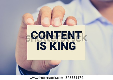 CONTENT IS KING message on the card shown by a man
