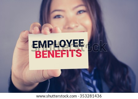 EMPLOYEE BENEFITS, message on the card shown by a businesswoman, vintage tone