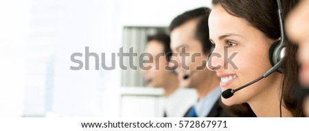 Smiling call center team, panoramic banner with copy space