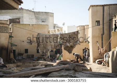 TETOUAN, MOROCCO - January 5, 2013: The Tanneries. The traditional methods of processing cattle hides, which are soaked in pools containing tannin, then washed and dried, to get the leather.