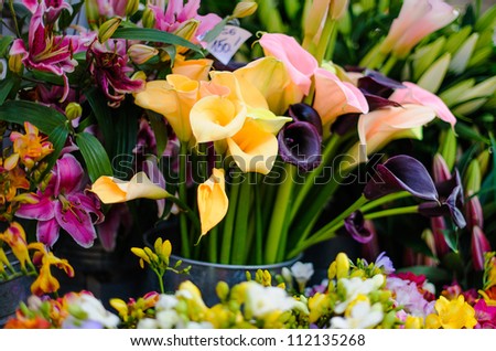Various flowers in the busket for selling