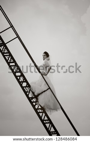 beautiful bride walks the stairs, black and white