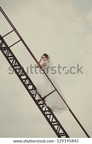 beautiful bride walks the stairs