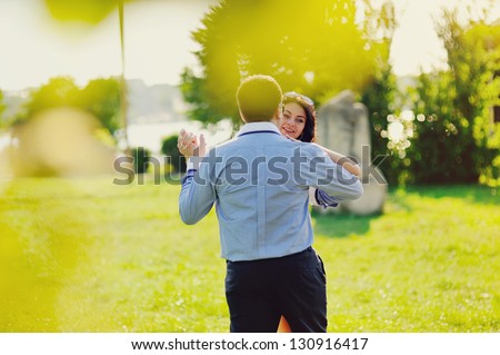 Heterosexual Couple dancing  in park