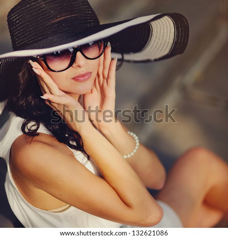 pretty young sexy summer girl wearing a hat