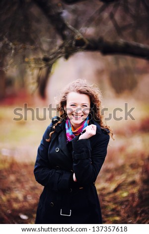 caucasian young girl portrait, messy curly red hair
