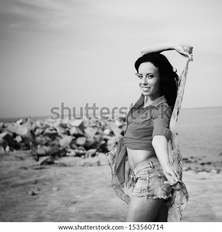 sexy young brunette by the sea, black and white