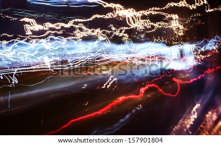 Traffic lights in motion blur, high contrast.