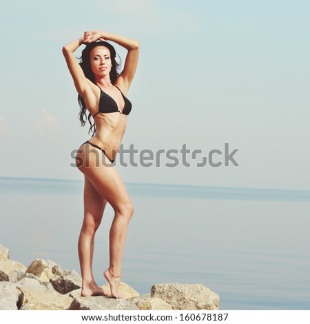 Perfect body shape. Young caucasian brunette woman.
