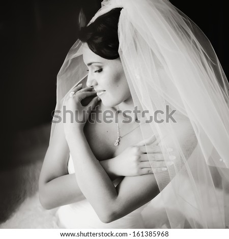Young bride in the morning at home. Black and white picture