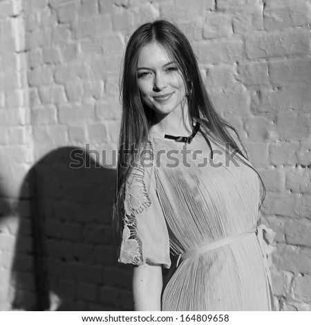 black and white street portrait of young beautiful woman