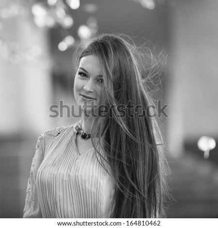 portrait of young beautiful woman with windy hair