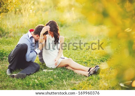 Couple having date, spending great time in garden on summer sunny day.