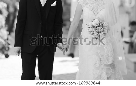 Wedding couple walking street, wedding fashion, black and white.