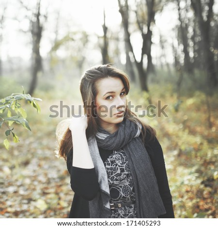 Natural portrait of young woman in park