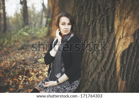 Natural portrait of young woman in park